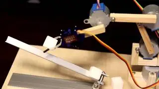 Small Stepper Robot Arm Shuffling Sugar Cubes