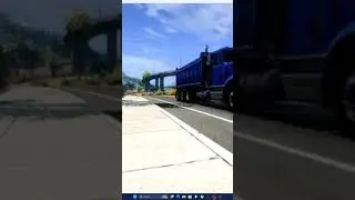 Old Freightliner dump truck entering the highway.