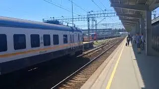Lastochka train passing through Shcherbinka MCD station without stopping.