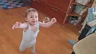 Simon playing with soap bubbles  13 1/2 month old