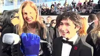 Justine Triet and Milo Machado Graner ('Anatomy of a Fall') on 2024 Golden Globes red carpet