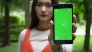 Green Screen Effects || Beautiful Woman Using Smartphone And Showing Green Screen To Camera