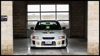 Lancer Evolution V RS playing on a wet track