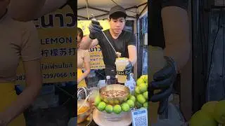 A handsome merchant sells honey and lemon soda, setting up a beautiful shop in Chiang Mai, Thailand.