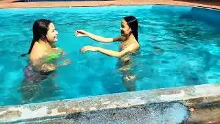 Beautiful babes playing in the pool