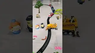 Squirrels are playing on construction truck vehicle near the track and train is approaching fast