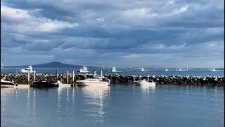 America's Cup racing has been postponed due to a lack of wind. Boats are heading back to the marina