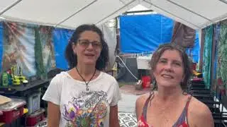 Two women enjoy Communal Showers
