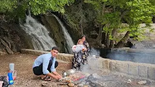 Journey to the Heart of Nature: Nomadic Family's Adventure at a Magnificent Waterfall