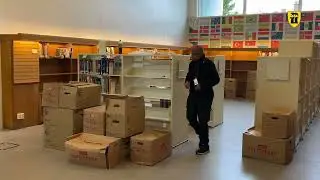 Bøkene settes på plass i nytt bibliotek