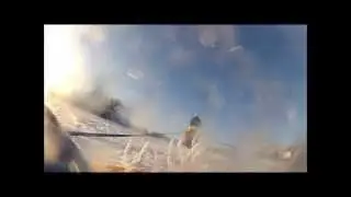 Dragged in a rubber boat behind a race horse in the snow