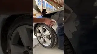Applying gray putty on fender nicely 