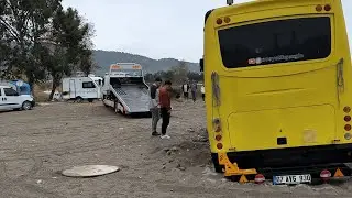 WE WERE BURIED IN THE SAND WITH THE BUS CARAVAN AND ALMOST TOPPED OVER