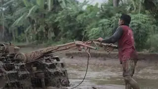 How to Operate a Tractor to Plow a Field