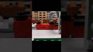 LEGO steam trains pass through the station 