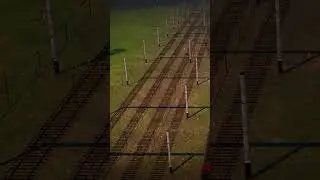 Красный Эр200-???? пролетает грузовую станцию 