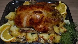 duck baked in the oven with potatoes and apples