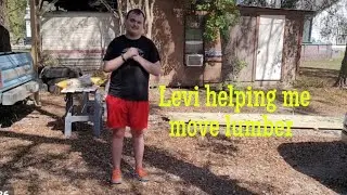 Levi helping me move lumber