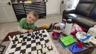 Grandson and I playing our version of chess.
