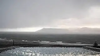 Intense Hailstorm and Torrential Rain Unleashed Over Ocean with Ominous Cloudy Skies