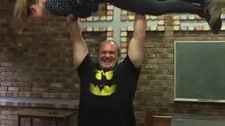 Strongman overhead lifts woman with reps