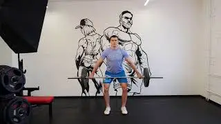 Шраги со штангой широким хватом с рывком