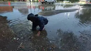 Unclogging storm drain culvert after heavy rain