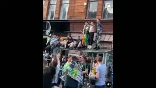 Celtic fans crash through bus shelter causing hundreds of pounds of damage.