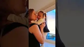 Mom Kissing Baby Daughter 