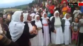 Ezidi refugees commemorate victims of genocide at camp in Greece