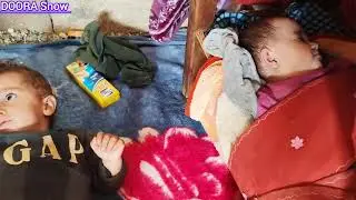 Sad and hardworking:single father with two babies in mountains