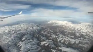 Снежные горы с высоты полёта Airbus A330. 4k video
