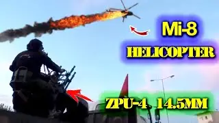 ZPU-4 4x14,5 mm anti-aircraft gun mounted on a truck is firing at transport helicopters