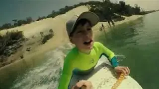 Going down a sand dune and hydroplaning into the water..