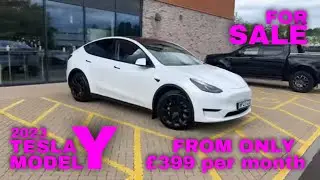 Pearl White Tesla Model Y with 20'' induction alloys...