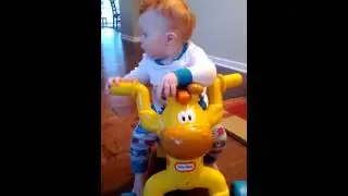 Gavin rides his giraffe