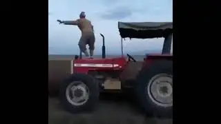 crazy man dancing on the plower while ploughing