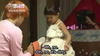 G- dragon is shying to look this little girl