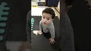 11-month-old baby cleaning the floor