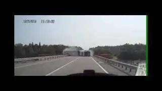 A large semi truck loses control and overturns