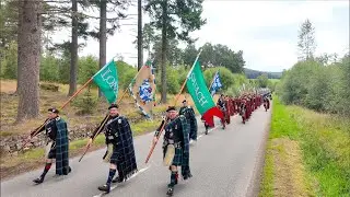 2024 Lonach Gathering Highlanders march through Strathdon in the Cairngorms National Park, Scotland
