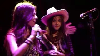 Brynn Marie brings little girl on stage.