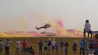 Two helicopters collecting crew and taking off