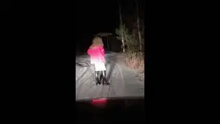 Crossdresser. Walking in the snow in high heels.