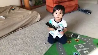 Arhaan is talking with the TV remote