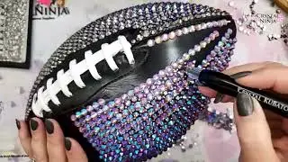 In this tutorial, I demonstrate the process of rhinestoning a football using the cushion method or p