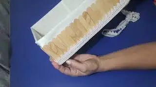 Cesta #reciclagem  com caixa de papelão e palitos.