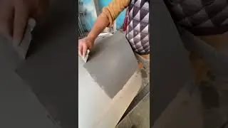 Applying gray putty on door nicely 