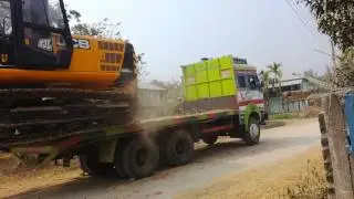 Epic way of unloading an excavator (Nepali style)