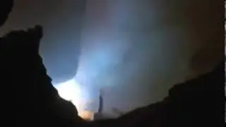 Looking into an electric arc furnace with the power on